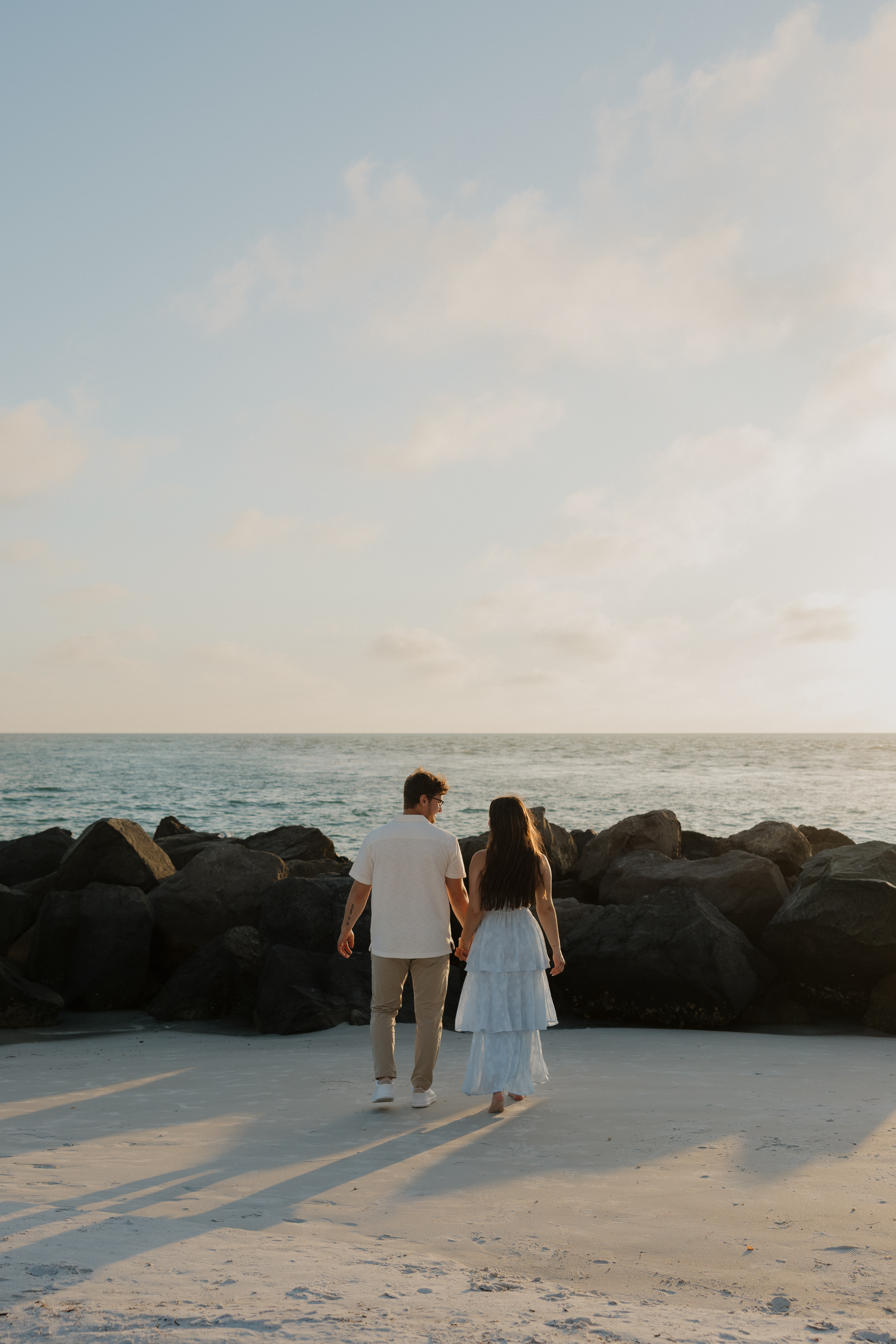 Alyssa and Caden walking toward the water